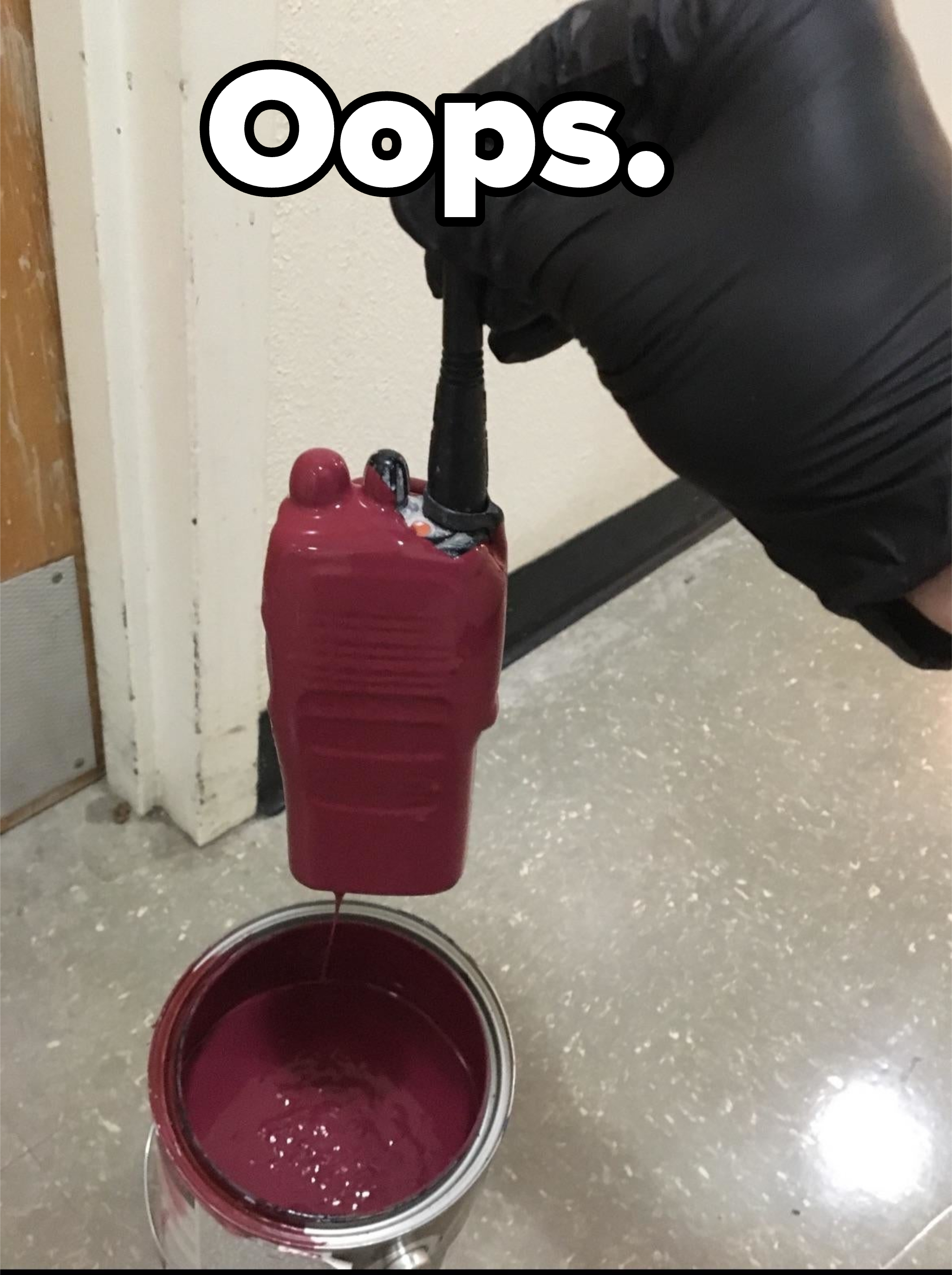 A person wearing a glove refills a small, transparent soap dispenser from a large can of liquid soap