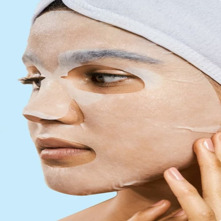 Model wearing a facial sheet mask