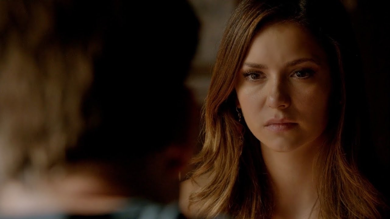 Elena from The Vampire Diaries with a concerned expression, facing an unseen character