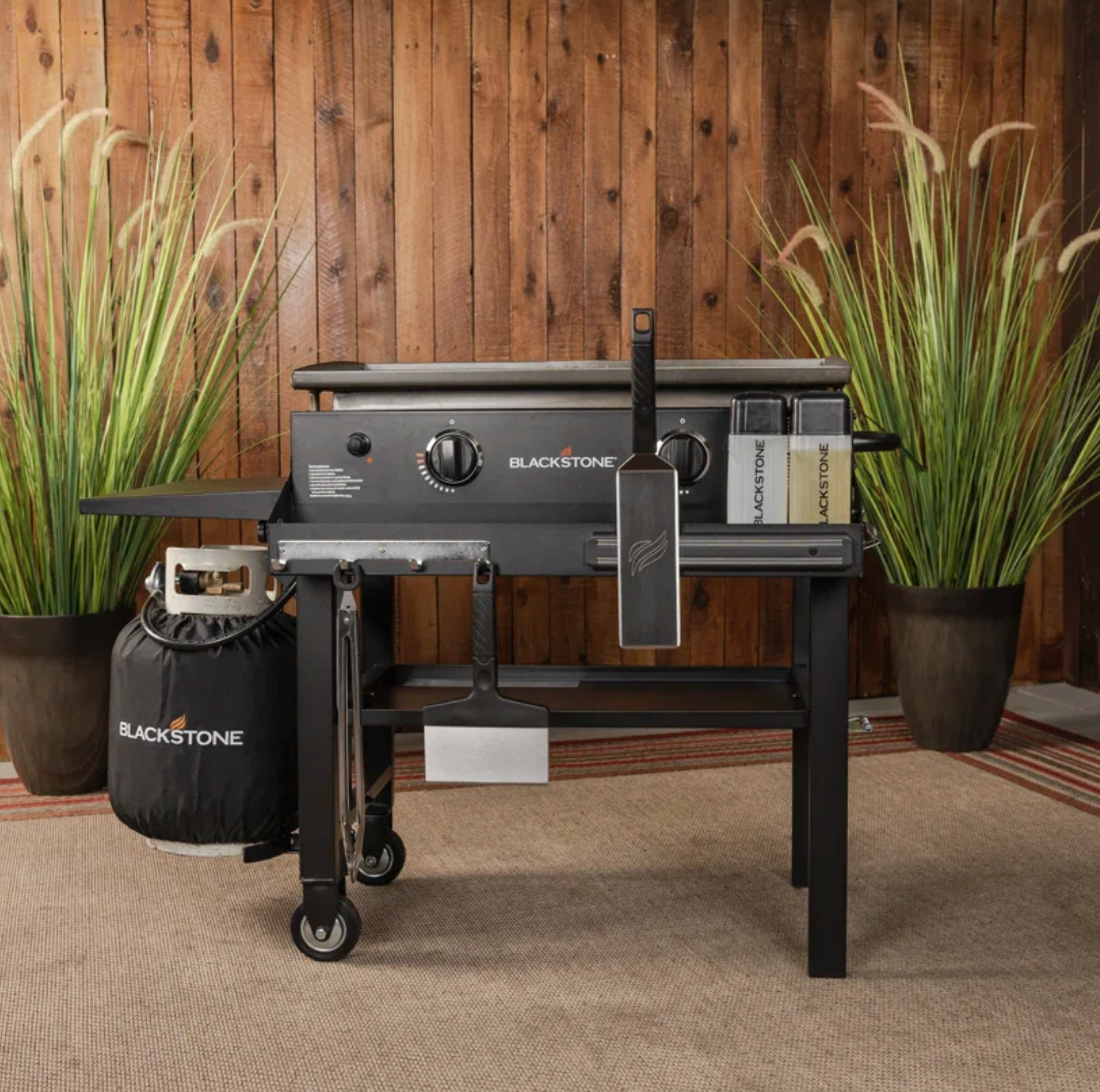 Blackstone gas griddle setup on a patio, featured for outdoor cooking and entertainment shopping guide