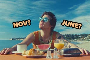 Person at a beachside table with breakfast, wearing sunglasses, and a knit top, with text "NOV? JUNE?" overhead