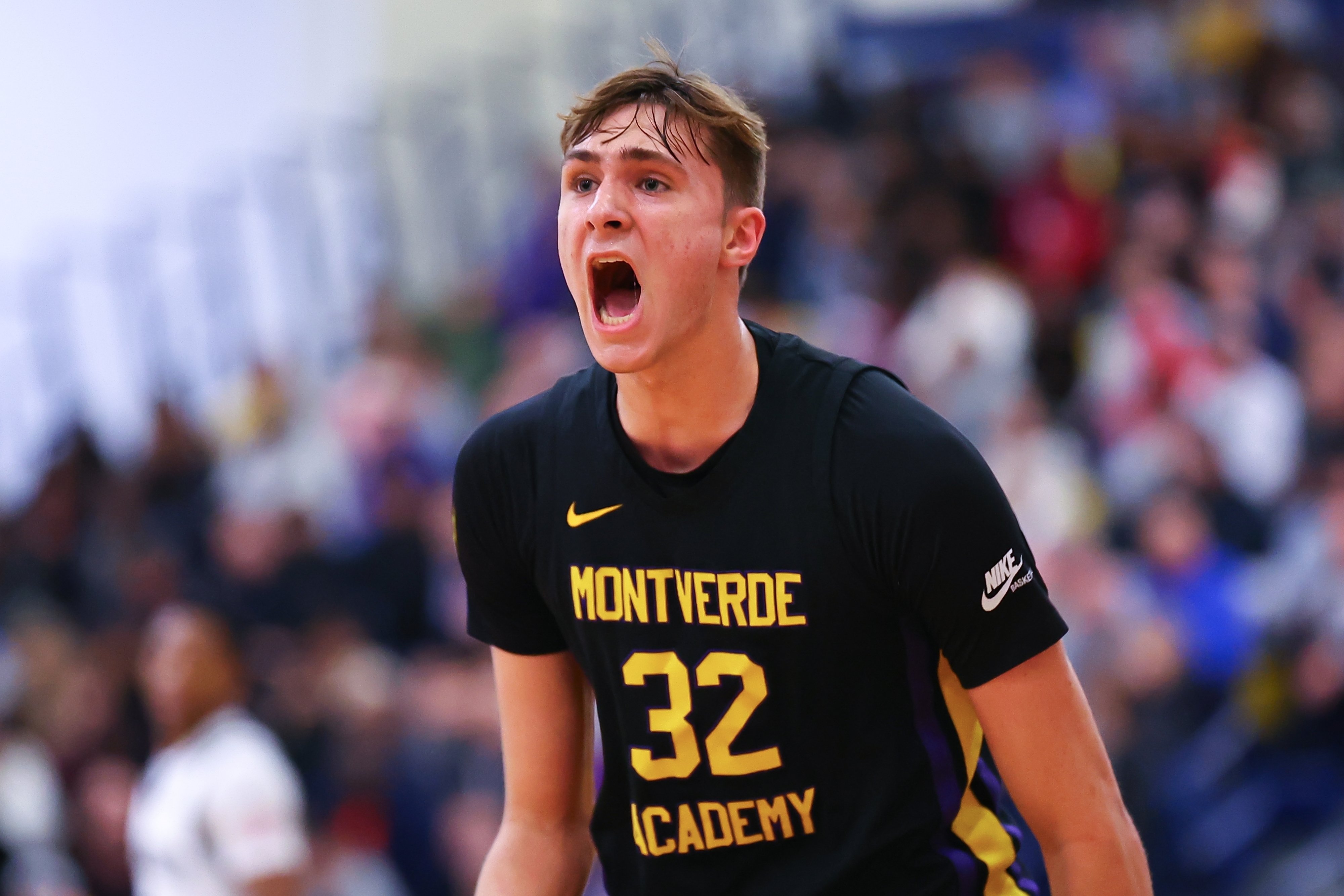 Basketball player in Montverde Academy jersey celebrates during a game