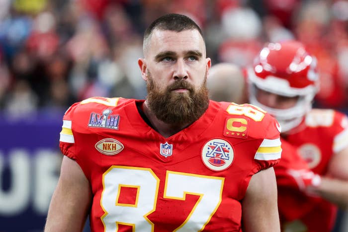 Kansas City Chiefs player in uniform with number 87 and a captain&#x27;s patch on the field