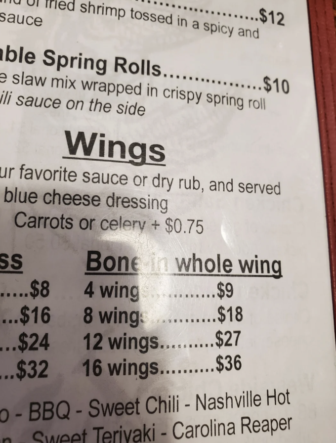Restaurant menu listing four wings for $9