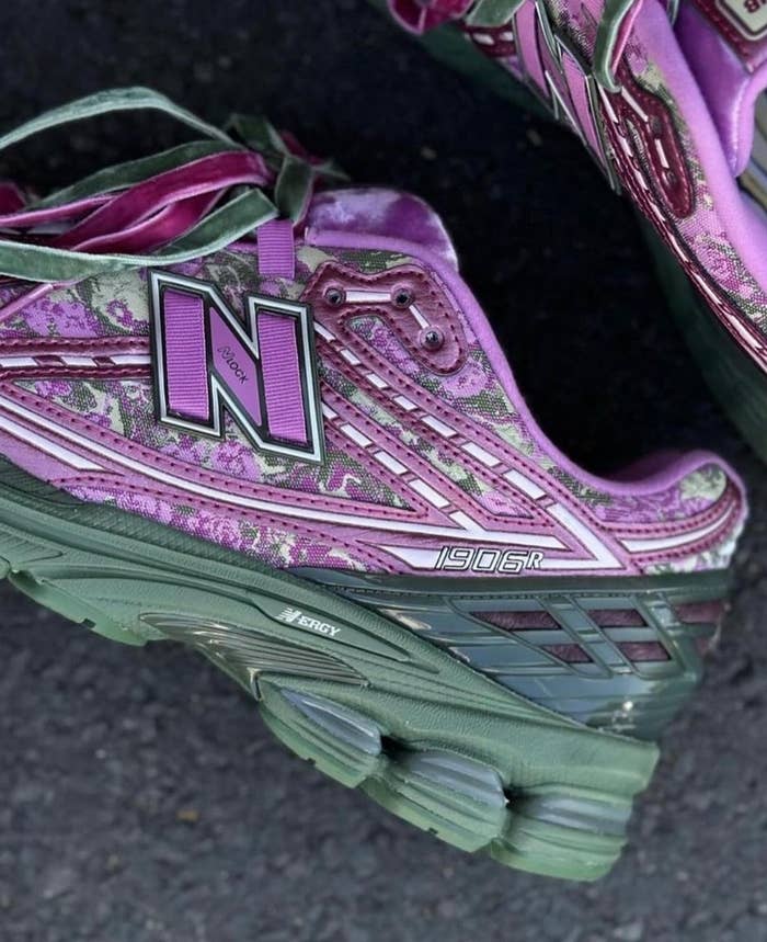 Close-up of worn New Balance sneakers with intricate patterns
