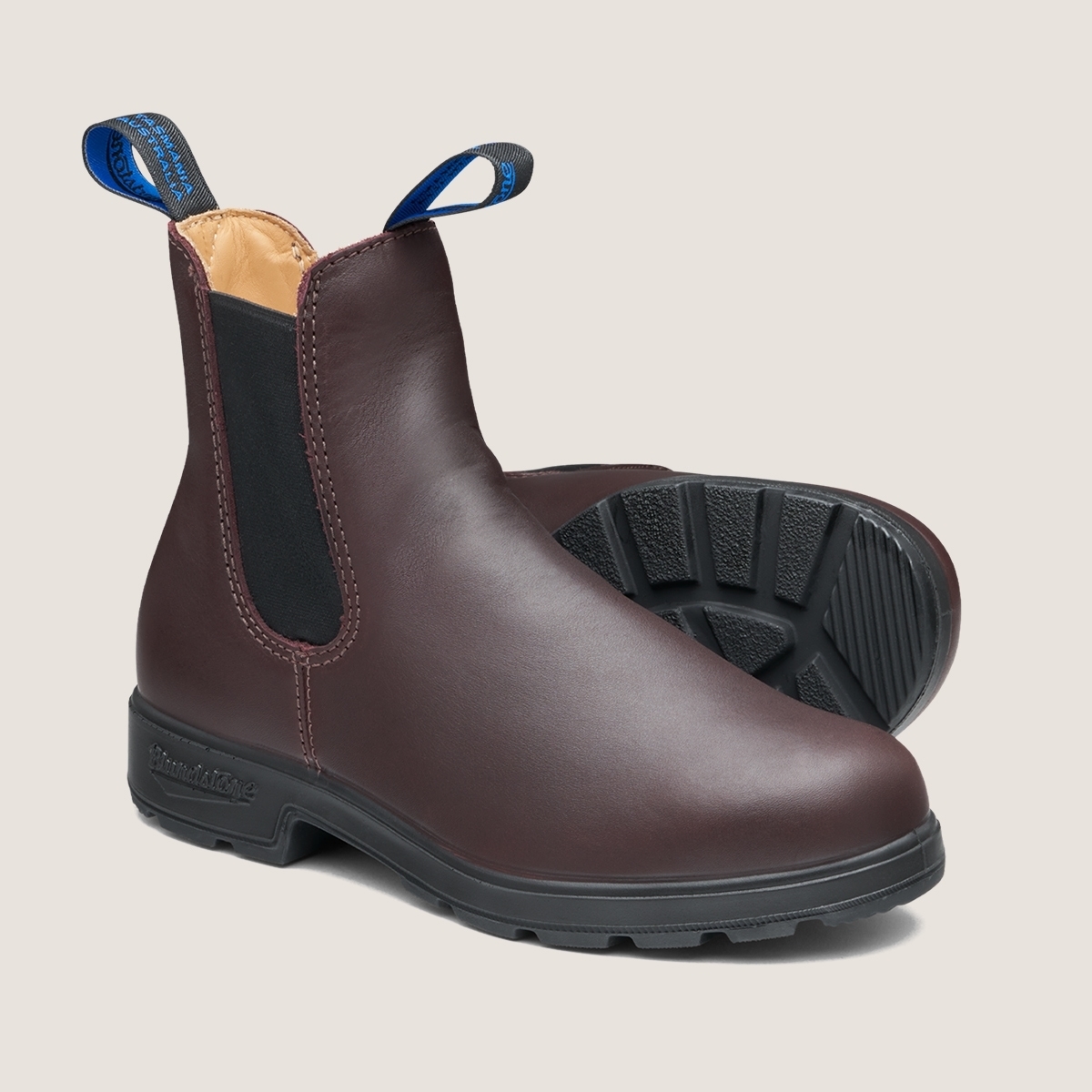 brown Blundstone Chelsea boots with black elastic side panels and pull tabs and