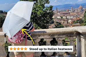 Person with umbrella viewing Florence cityscape. Review: "Stood up to Italian heatwave."