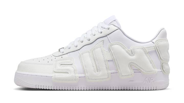 White Nike Air Force 1 sneakers with bold "SUN!" text on the side