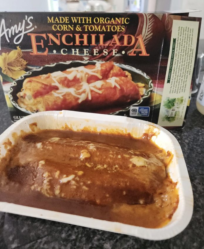 Frozen enchilada meal next to its packaging box on a kitchen counter