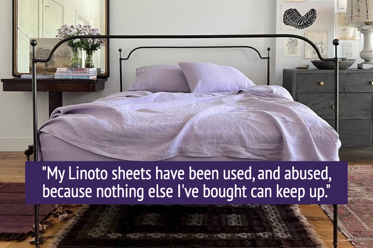 bed made with purple linen sheets with quote "My Linoto sheets have been used, and abused, because nothing else I've bought can keep up"