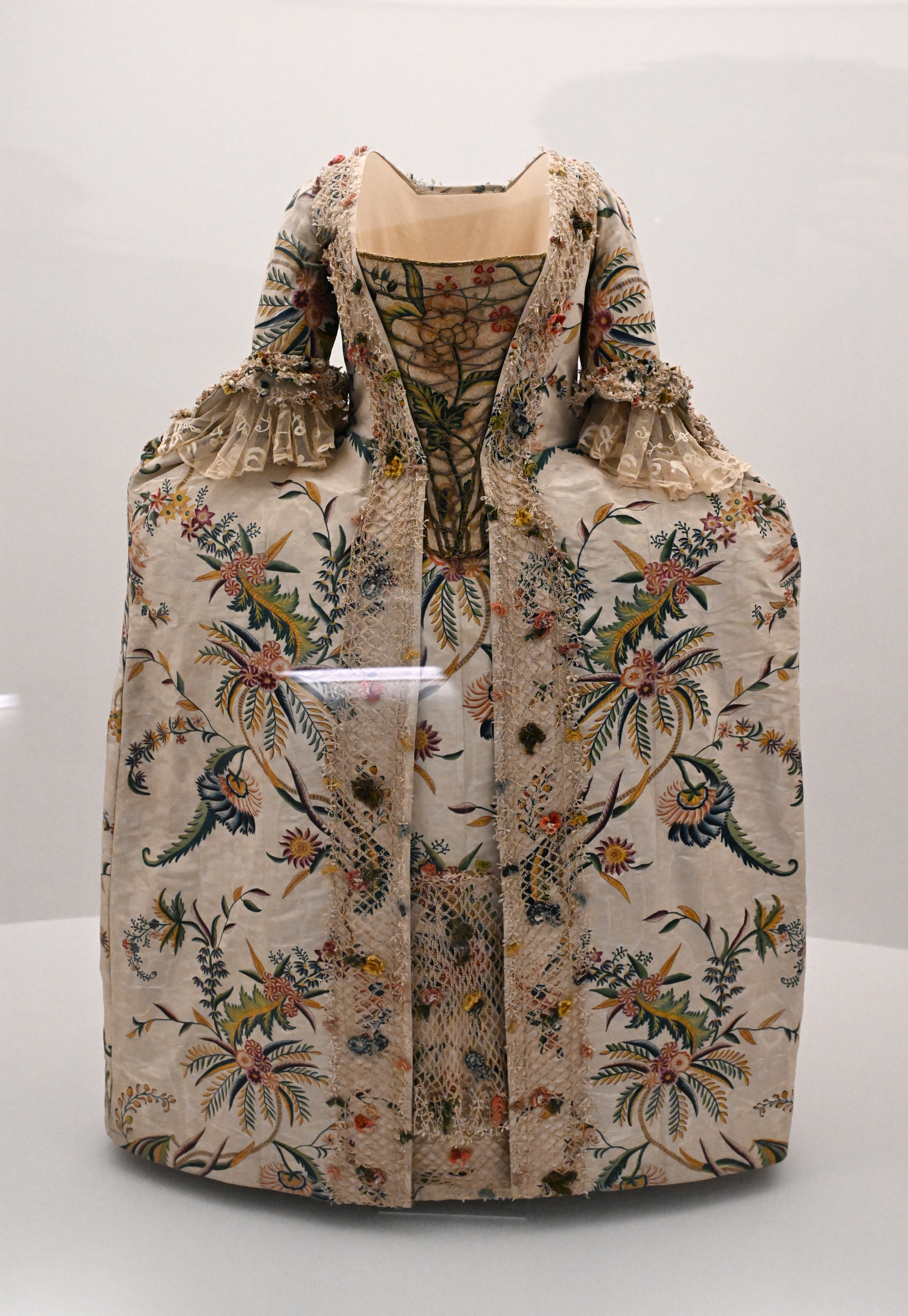 Ornate floral embroidered historical dress on display