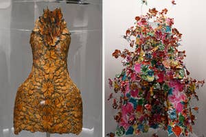 Two dresses on display, one with floral embroidery, other with 3D floral appliqués, exhibiting intricate design details