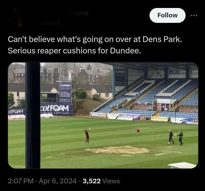 Image of a sports stadium with unexpected oversize cushions on the field, tweeted in disbelief