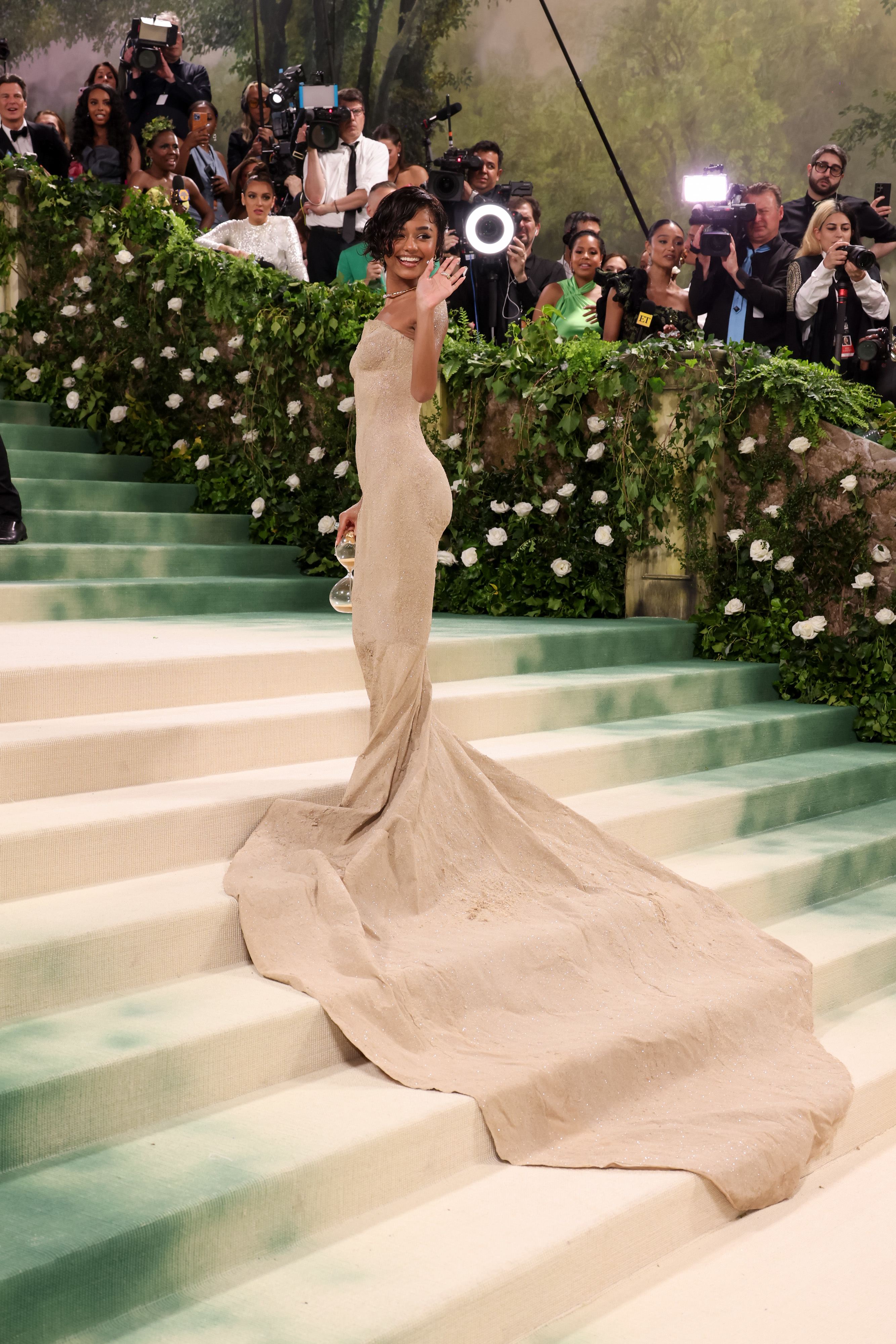 Tyla posing on the Met Gala steps showing her gown&#x27;s long train