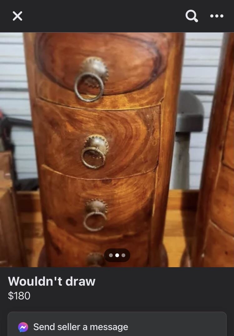 Wooden dresser with unique knot patterns and round handles, mistakenly thought to have drawers