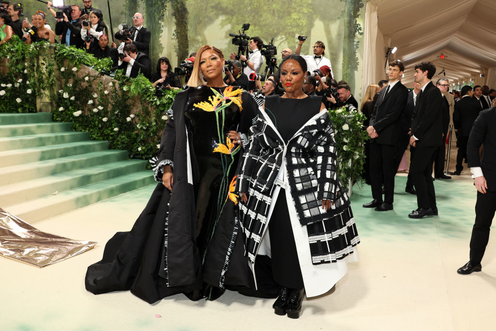 Queen Latifah in a gown with flower details, Ebondi in a plaid gown