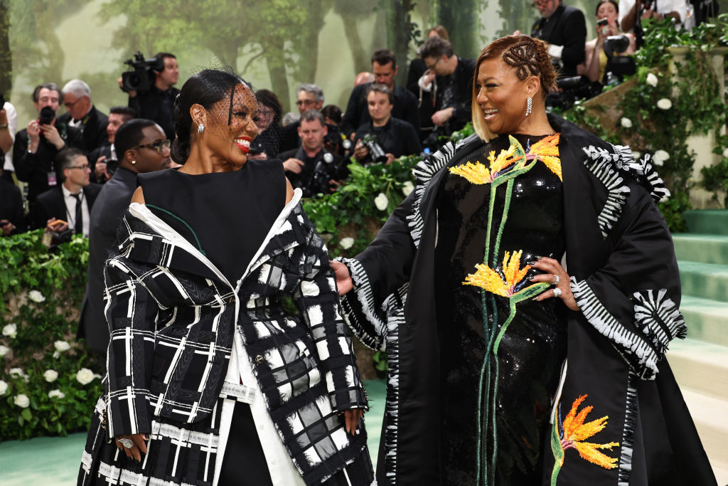 Eboni and Queen Latifah smiling at each other
