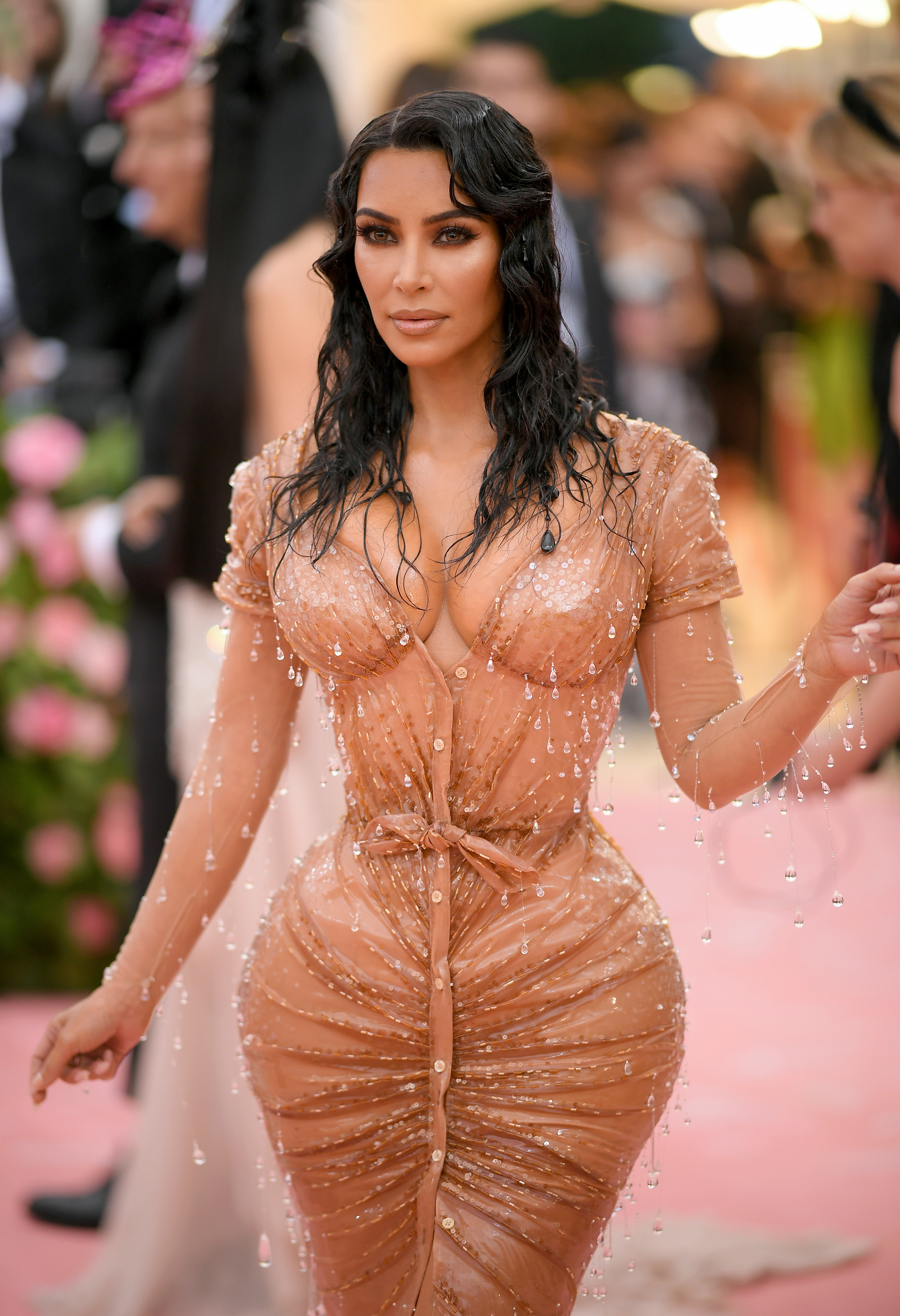 Kim Kardashian in a beaded, figure-hugging dress at an event