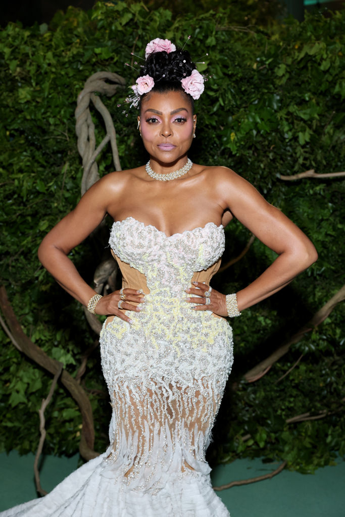 Taraji P Henson in a floral-embellished, corset-style gown with a sheer skirt at an event