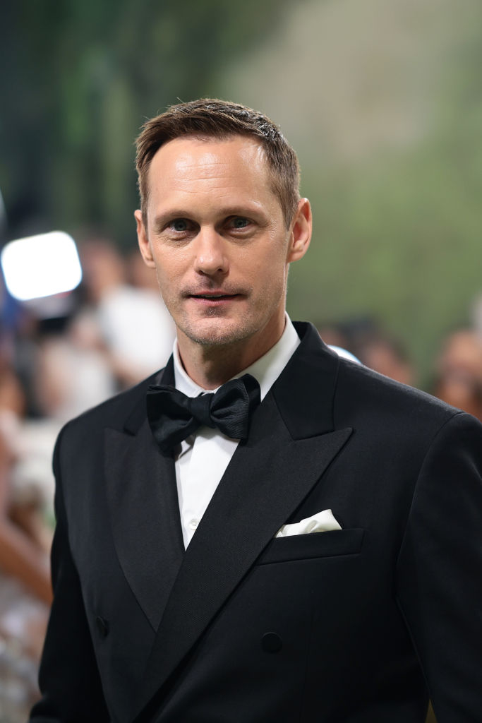 Alexander Skarsgard in a black tuxedo and bow tie at a formal event