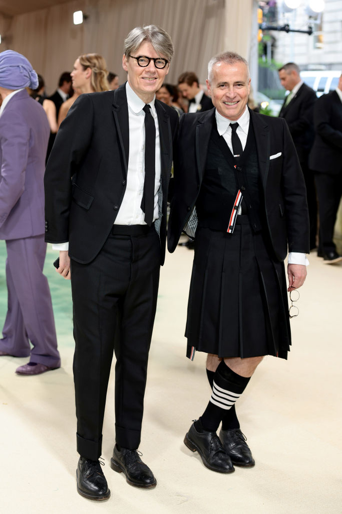 Andrew in a suit and Thom in a kilt and knee-high socks