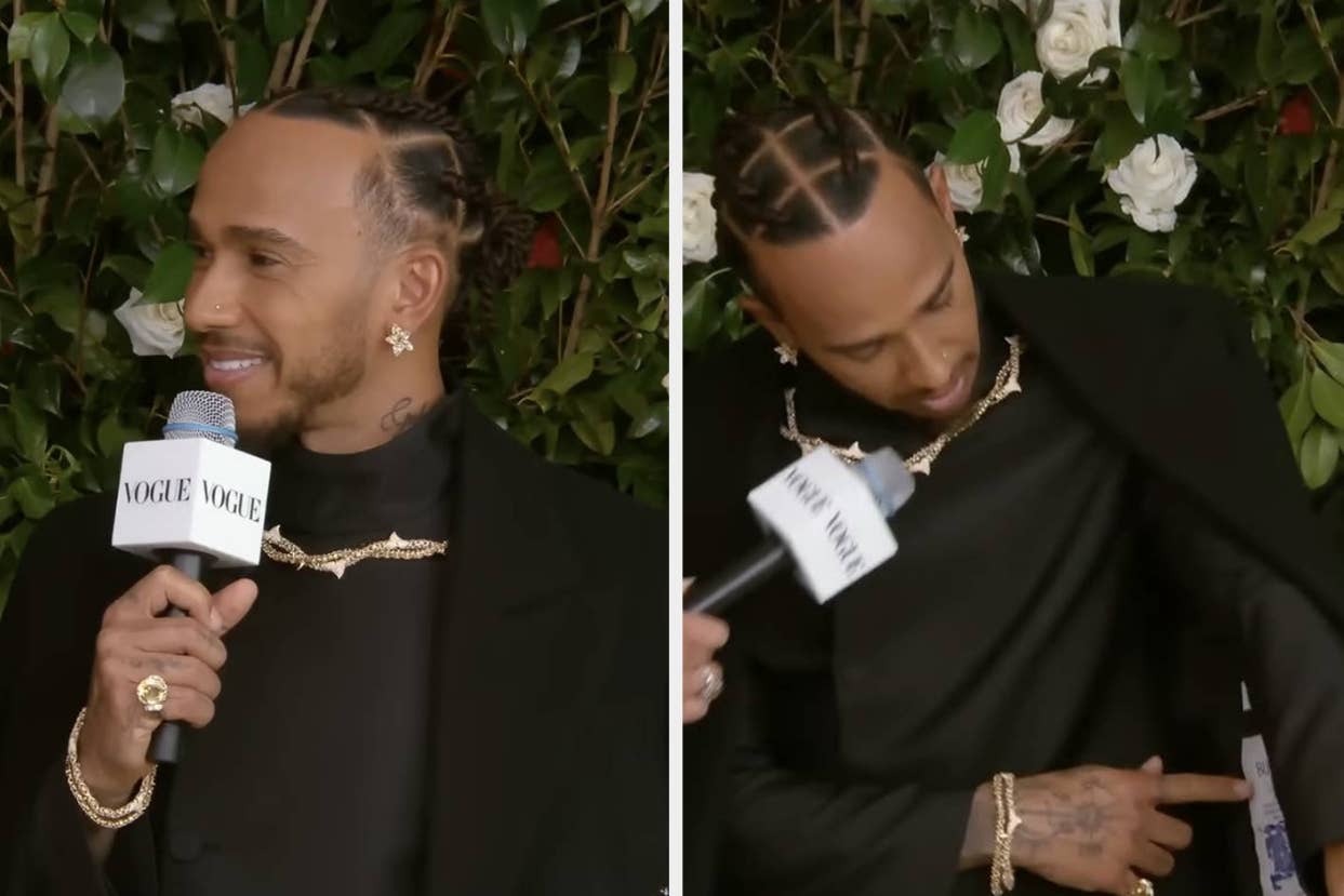 Lewis Hamilton in a black outfit with gold chains, speaking into a Vogue microphone