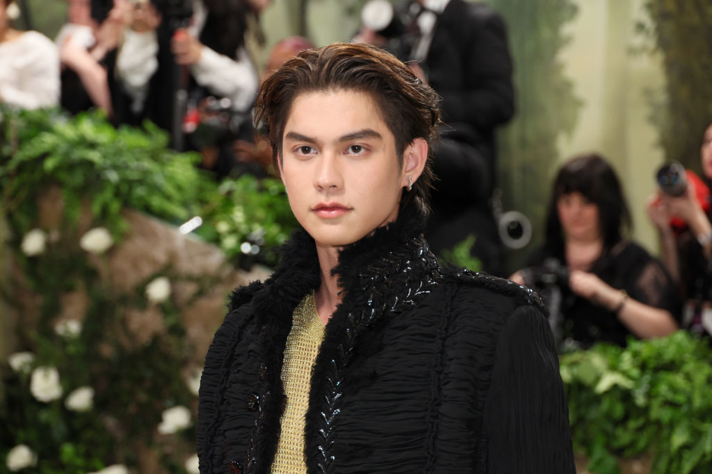 Bright posing on the Met Gala carpet wearing a black embellished jacket
