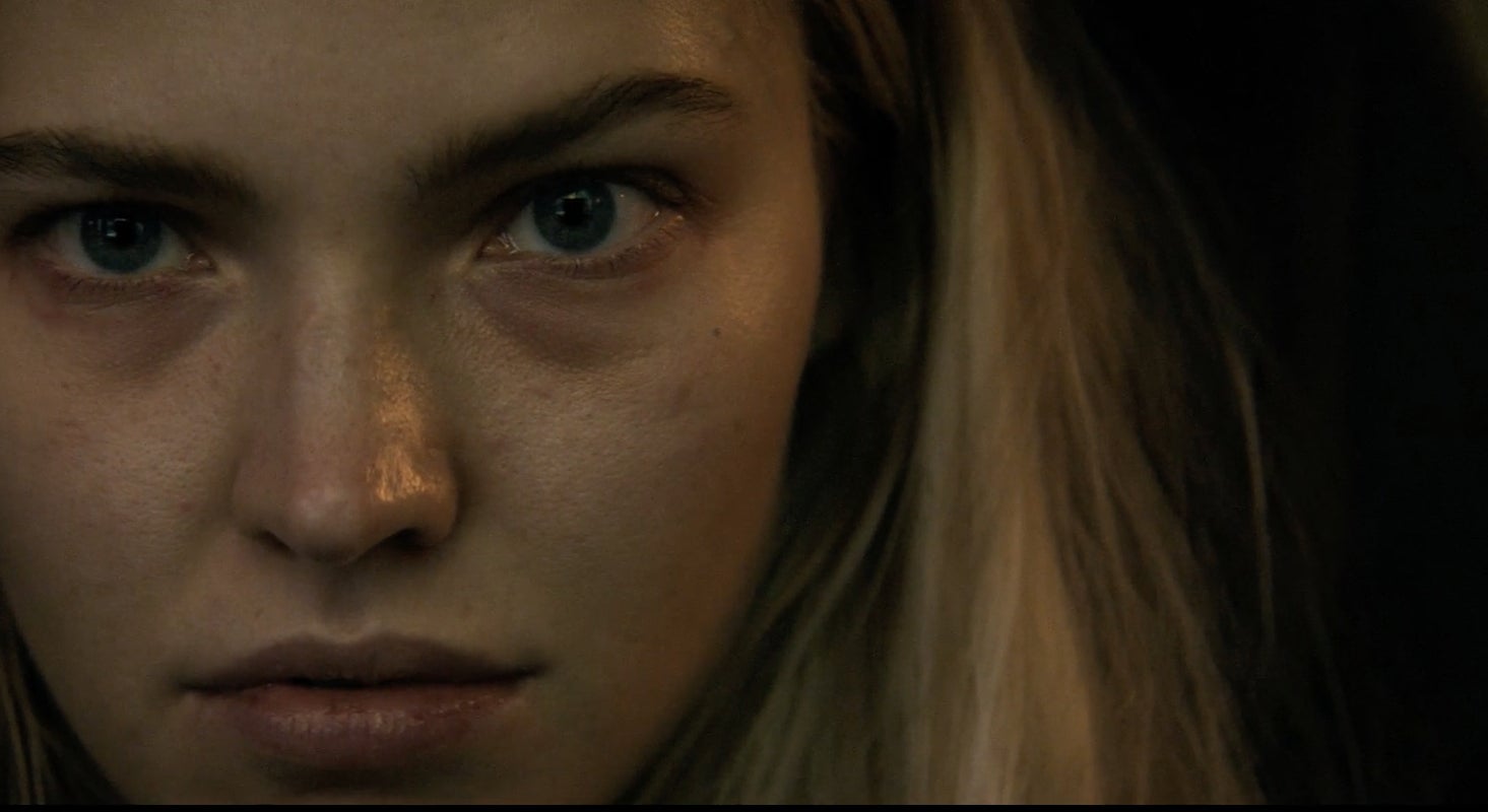 Close-up of Sasha Luss&#x27;s intense expression in Latency