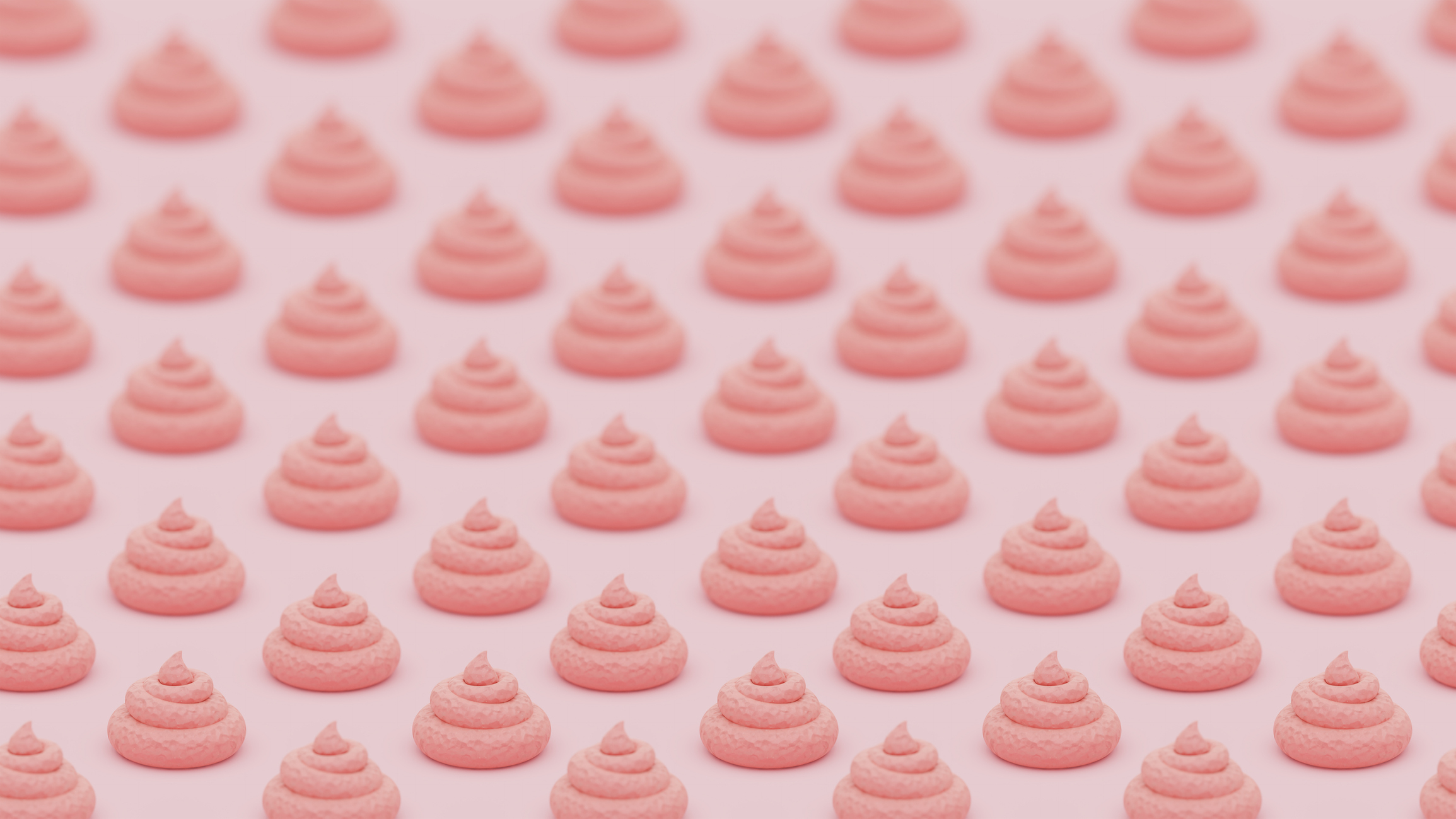 Multiple swirls of pink frosting arranged in a grid pattern on a light background