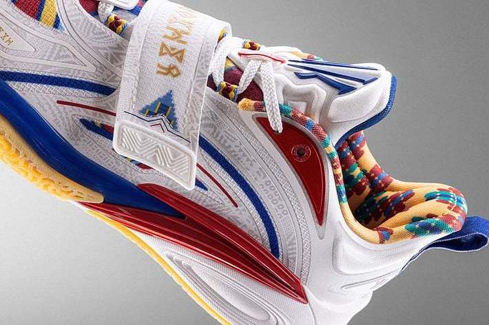 Close-up of a colorful athletic sneaker with intricate design details and textured layers