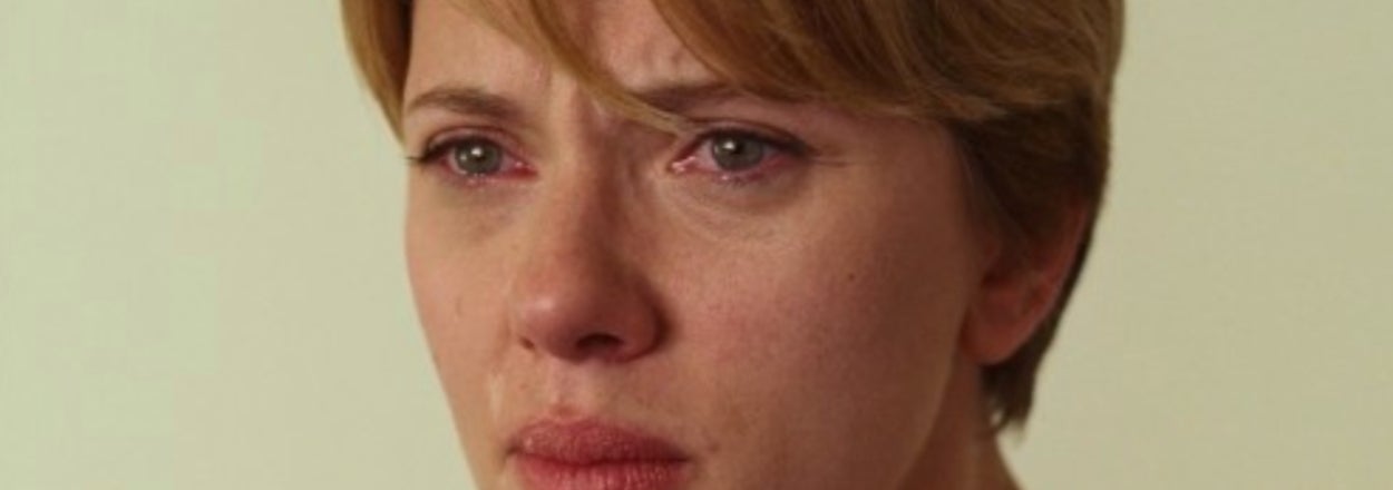 Close-up of Scarlett Johansson portraying an emotional scene, tears in her eyes