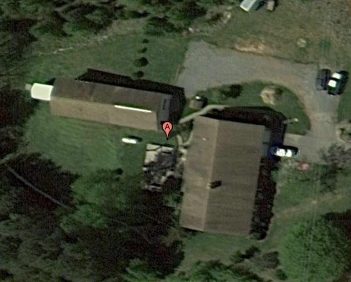 Satellite view of a building with a red marker labeled &quot;A&quot; near its entrance
