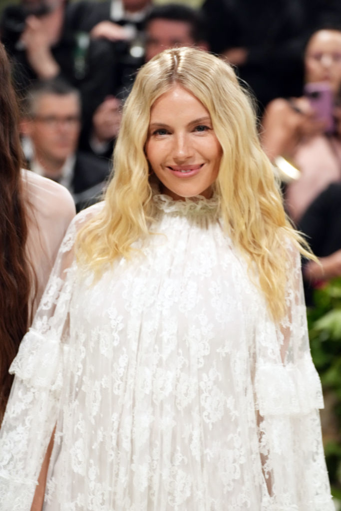 Sienna Miller in a lace dress at an event