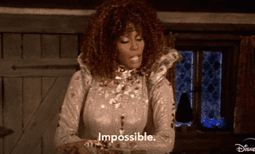 Whitney Houston as the fairy god mother with the word &quot;Impossible.&quot;