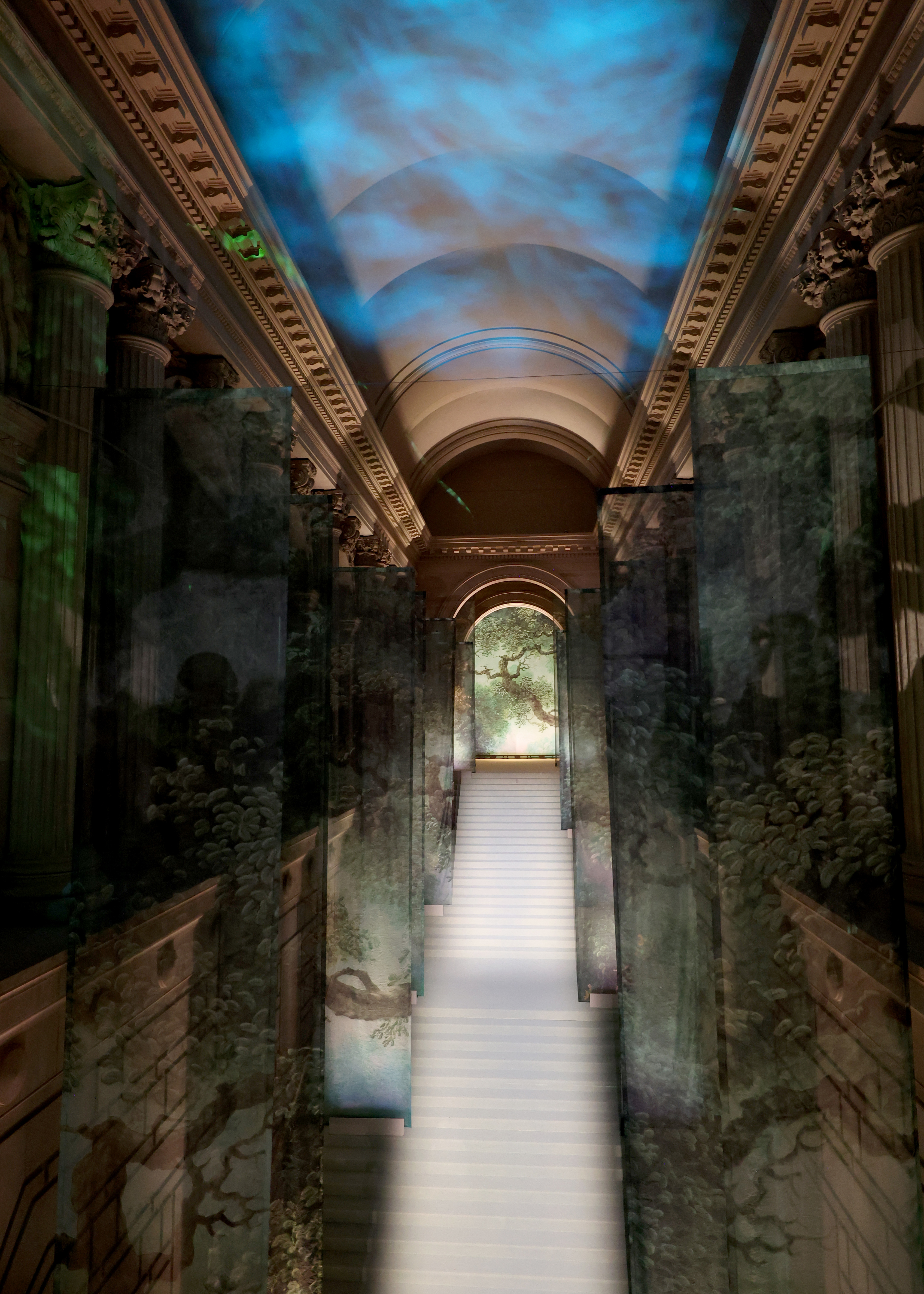 A long staircase The Met Museum building with a dynamic light installation creating an ethereal atmosphere