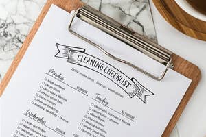 A printable of a cleaning checklist with tasks like "wipe surfaces" and "laundry, towels" under each day 