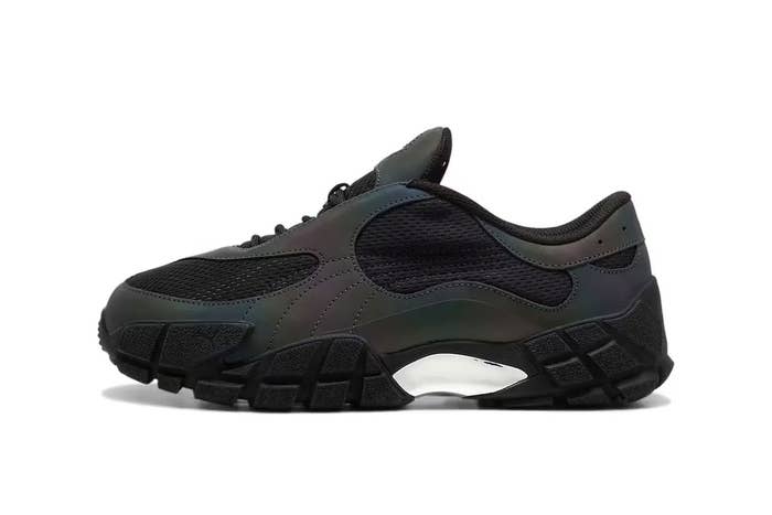 A single dark-colored sneaker with a chunky sole design