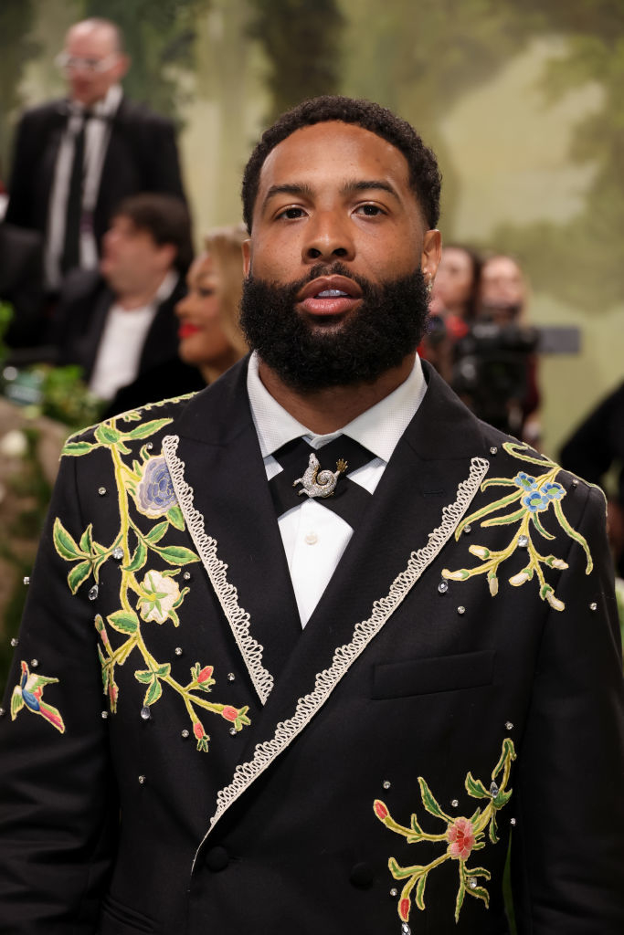 Odell Beckham Jr in an embroidered suit with floral patterns, at an event