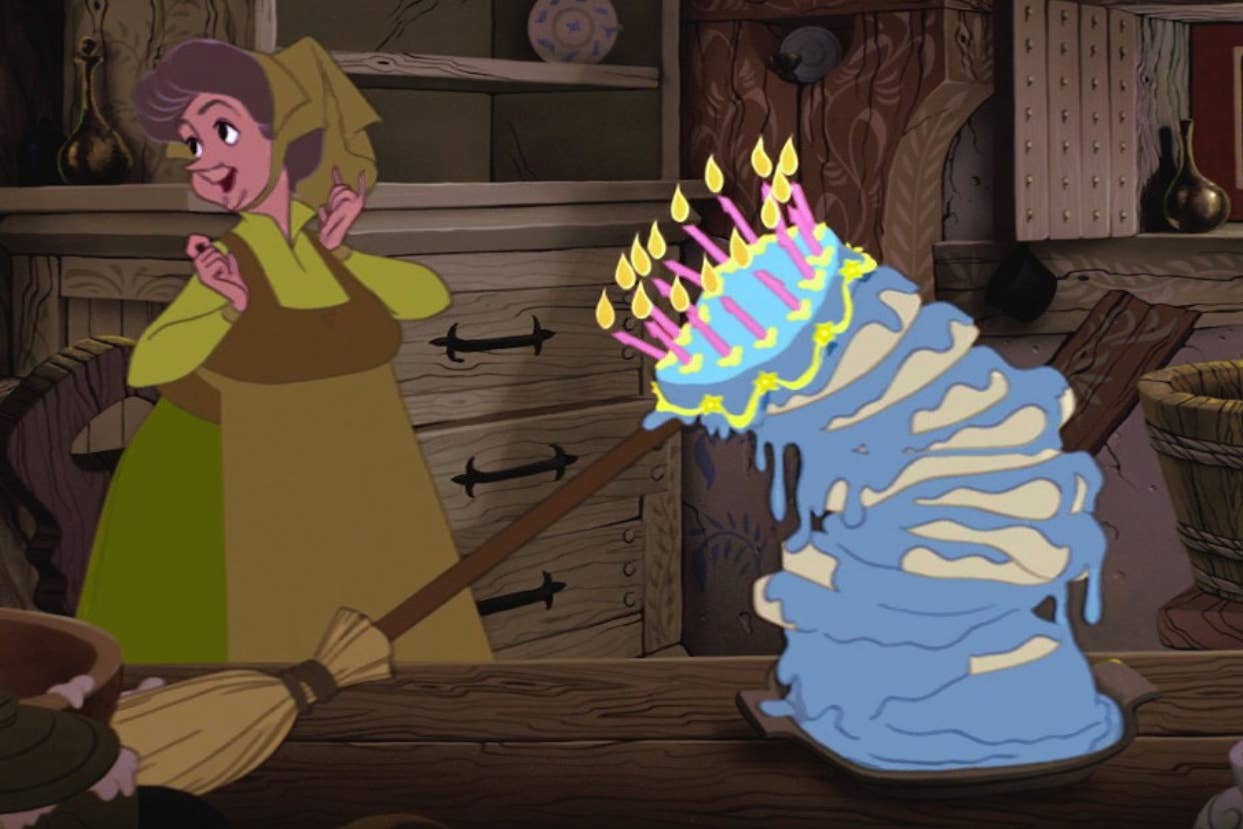 Animated character Marge from the show "The Simpsons" dressed as a witch, comically failing at using a broom to fix a toppled cake