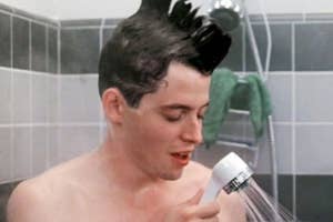 Man in shower with tall, upright hairdo seemingly singing or talking to himself