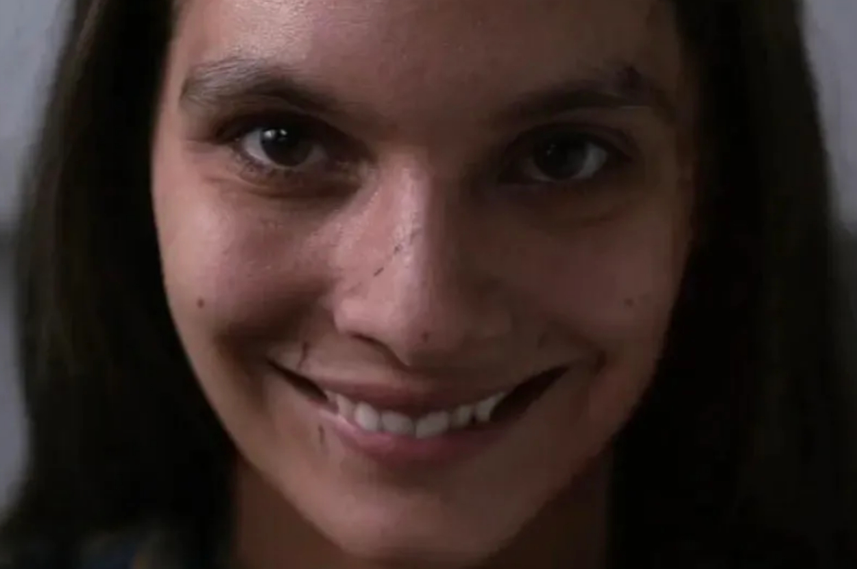 Close-up of a smiling woman looking directly at the camera