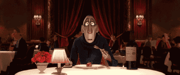 Anton Ego from &quot;Ratatouille&quot; looks surprised with a fork mid-air at a restaurant