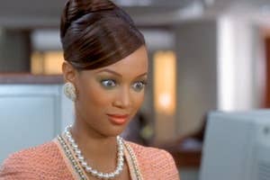 Tyra Banks as Eve, wearing a pink suit with pearls, in the movie "Life-Size."