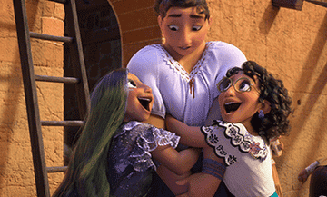 Mirabel, Isabela, and Luisa Madrigal from &quot;Encanto,&quot; are embracing joyfully