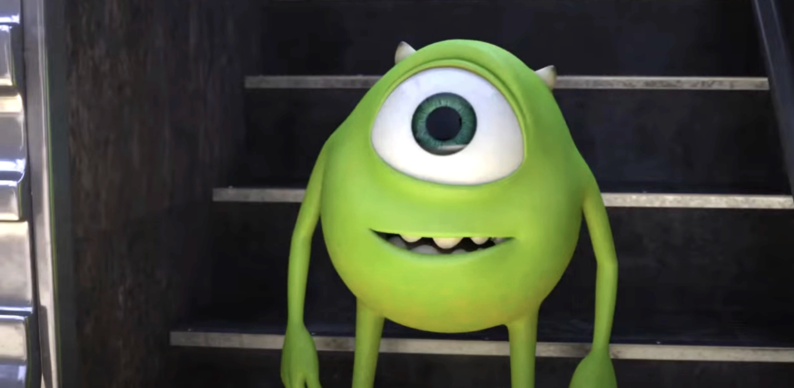 Mike Wazowski from &quot;Monsters University&quot; is standing and smiling