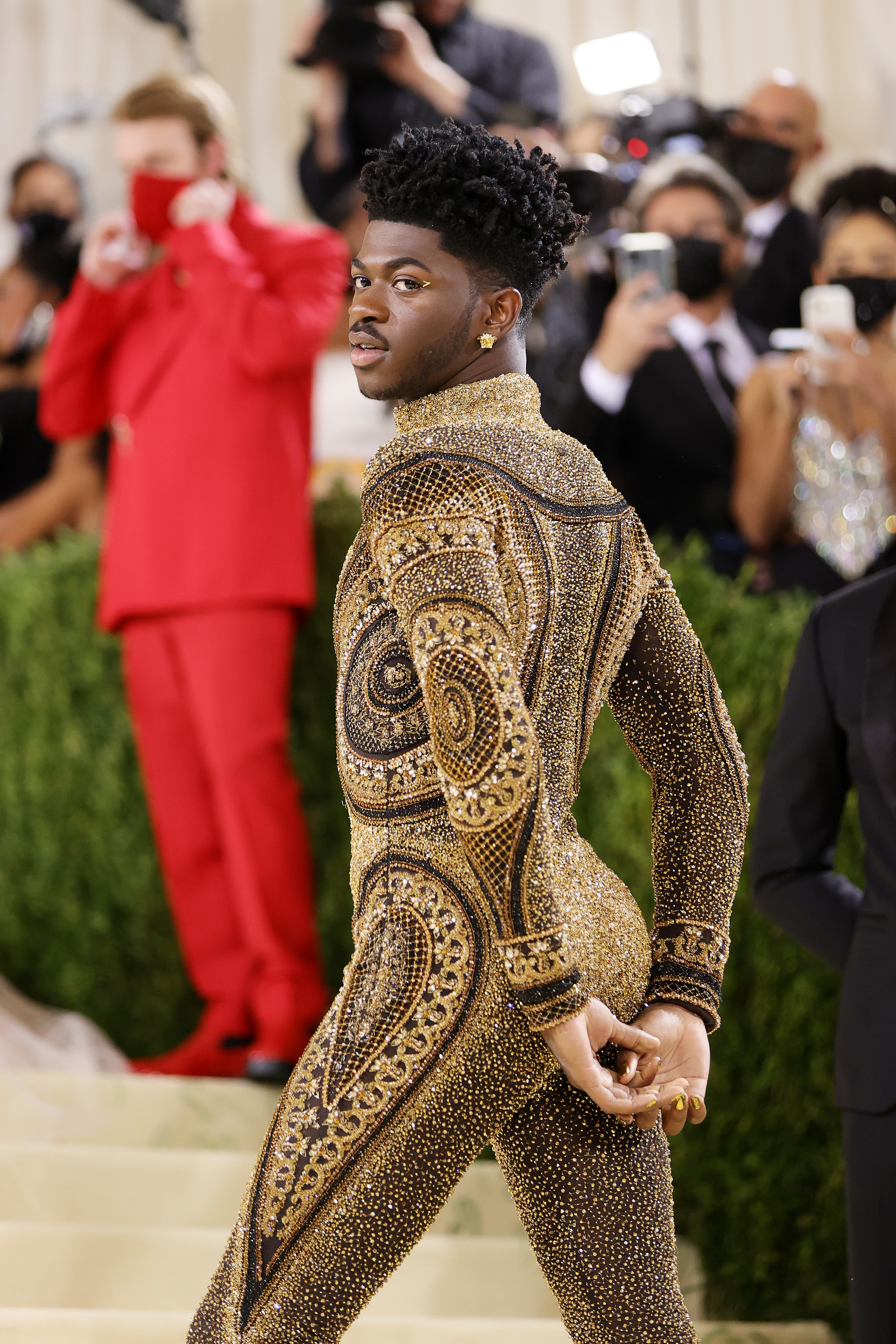 Lil Nas X in a glittering body suit