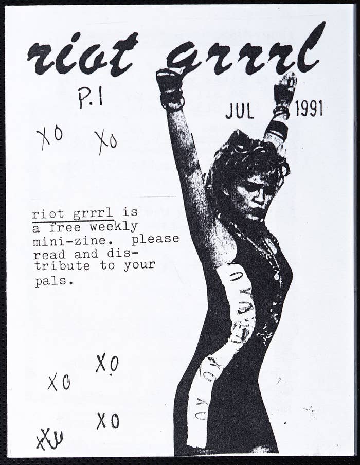 &quot;riot grrrl is a free weekly mini-zine. please read and distribute to your pals&quot; in text with black and white printed woman on the right. 