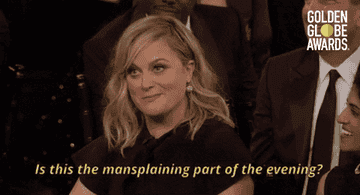 amy phoeler at an awards event laughing with subtitle about mansplaining