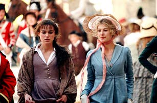 The Bennet sisters from "Pride and Prejudice" in historical costume walk together in film scene
