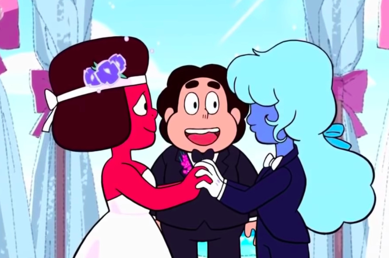 Ruby and Sapphire holding hands with Steven from "Steven Universe" in the middle, all are smiling. Ruby in a gown and Sapphire in a suit